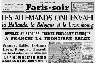 11 maja 1940 r. — Dokładna reprodukcja pierwszej strony Paris-Soir, paryskiej gazety, informującej o napaści Niemiec na Holandię, Belgię i Luksemburg (Domena publiczna).